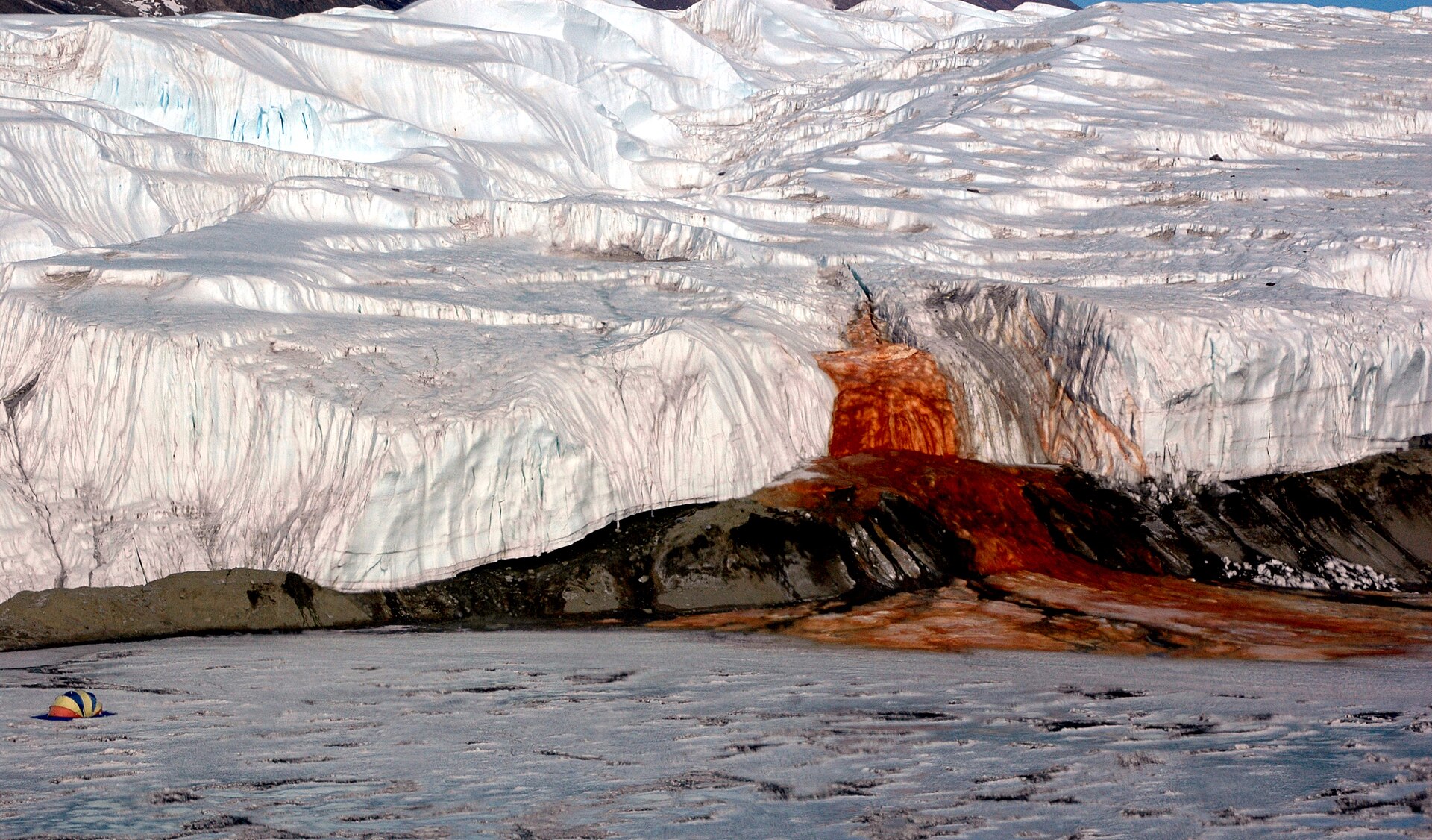Blood Falls red brine seeping from Taylor Glacier onto white ice, Antarctica.