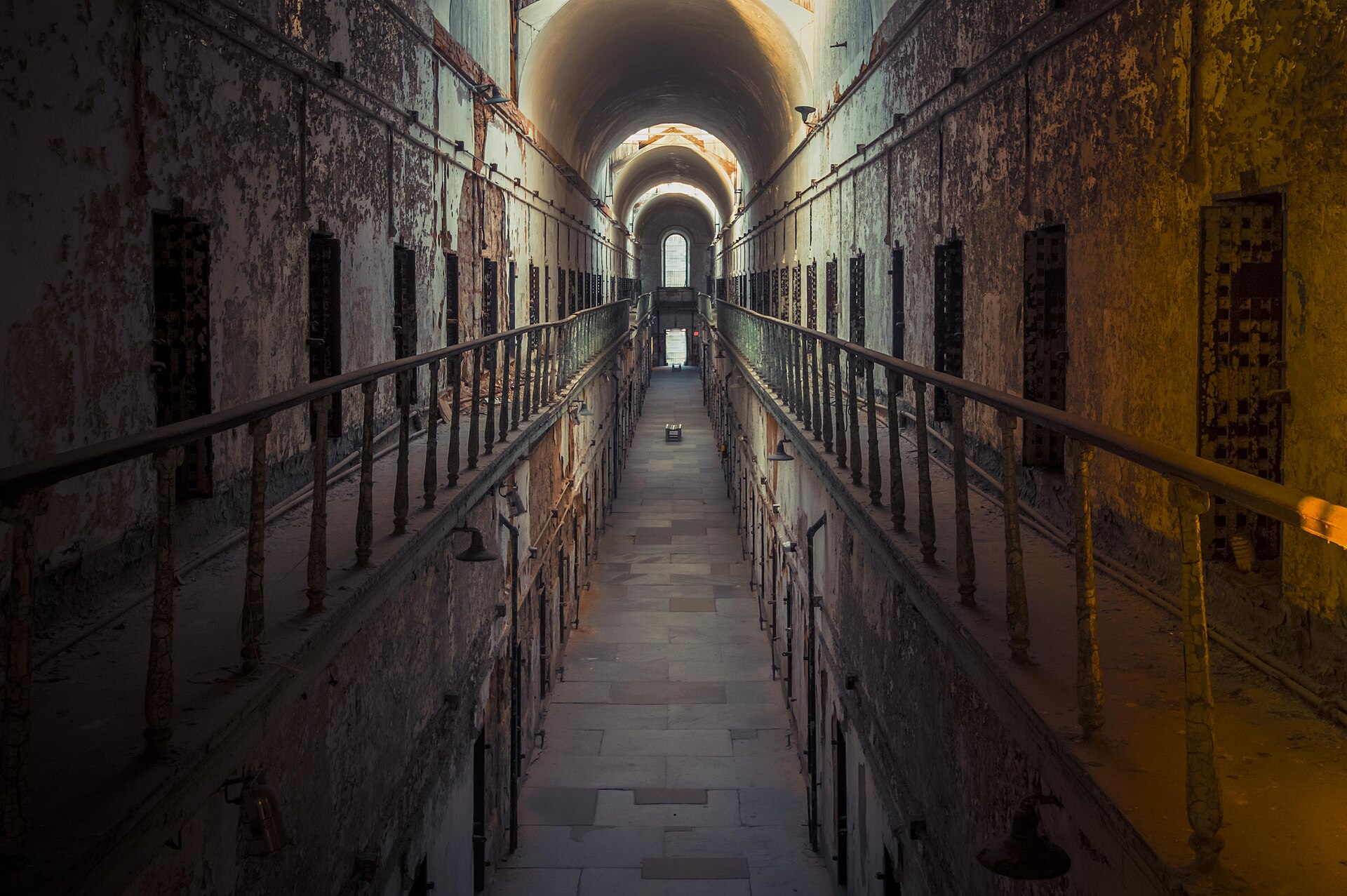 Interior of Cell Block 7 at Eastern State Penitentiary with skylights and decay.